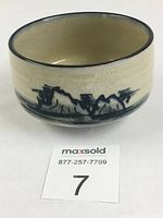 Side view of the Japanese Mino ware matcha tea bowl showing crackle glaze and cobalt mountain scene