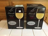Two boxes of Luigi Bormioli Crescendo Chardonnay glasses, showing box front with glass image and capacity 14 oz/38 cl.