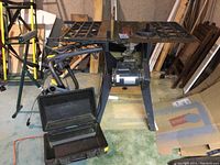 Wide view of Craftsman 10 inch table saw showing table, fence, motor and Craftsman black tool case