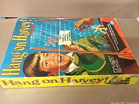 Complete 1960s Hang on Harvey game in original box with string tied around box to hold it closed.