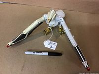 Top-down view of the Falcon Zord toy showing its wingspan and claw detail with a marker for scale.