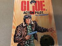 Front of the box showing G.I. Joe Action Pilot branding with a detailed pilot illustration and limited edition commemorative seal.
