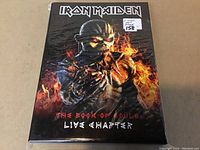 Front cover of Iron Maiden The Book of Souls boxset showing fiery warrior character.