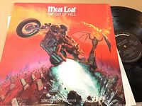 Photo of Meatloaf "Bat Out of Hell" vinyl LP cover and partially visible vinyl record.