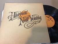 Front cover of the Neil Young Harvest LP with album title and artist's name in script on white background