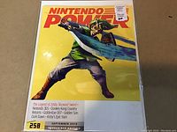 Front cover of Nintendo Power magazine issue 258 September 2010 showing Link from The Legend of Zelda: Skyward Sword with sword and shield on yellow background.