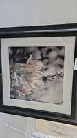 Frontal image of the framed floral print showing the flower details and frame.