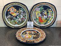 Front view of three plates arranged on counter