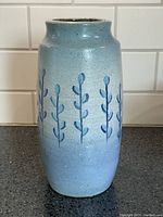 Full front view of vase showing overall form, glaze and painted motif