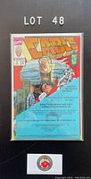 Front cover of Cable comic issue 2, showing full comic and certificate of authenticity in protective bag backed board.