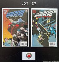 Photo shows two Daredevil comic books, issues 342 and 343 from 1995, bagged and boarded with clear protective bags and backing boards.