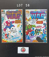 Photo of two Marvel comic books The Infinity War #3 and #4 from 1992, both bagged and boarded, showing front covers with vibrant artwork.