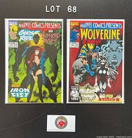 Photo showing two bagged and boarded Marvel Comics Presents comics, issues 129 and 130, positioned side by side on a black background with lot number above them.