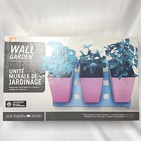 Box front showing Southern Patio Wall Garden set with three pink planters on blue wall mount, designed for indoor or outdoor use.