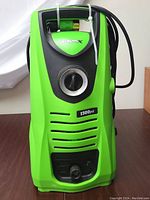 Front view showing green and black housing, power dial, 1500 PSI label