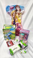 Lot contents with all items displayed including the Buzz Lightyear figure, Burping Bobby Hippo game, Boxy Babies Paisley doll in box, Disney Princess air mattress, and Sonic McDonald's toy in packaging.