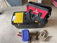 Photo of toolbox, Husky tool bag, roofing hammers, and stapler on floor