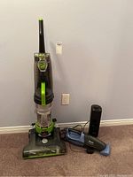 Bissell Powerforce Turbo Rewind upright vacuum, Shark cordless hand vacuum and Sunbeam oscillating fan all visible in the image.