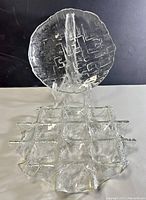 Photo of Kosta Boda Criss Cross Pergola serving platter showing geometric criss cross pattern and wavy edges