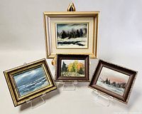 Set of four framed oil paintings by Joanne Modderman displayed together on easels and stands.