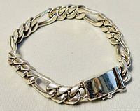 Men's sterling silver chainlink bracelet showing full shape and clasp