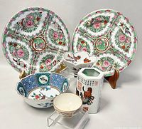 Overall view showing all six pieces including 2 large plates, 2 scalloped bowls, small bowl, and hexagonal vase