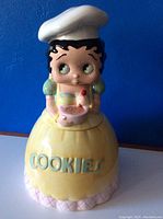 Front view of the Betty Boop cookie jar with the title 'COOKIES' embossed on the yellow skirt section.