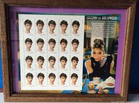 Framed sheet of 20 Audrey Hepburn unused US postage stamps with portraits and color images