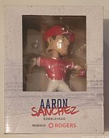 Front view of Aaron Sanchez bobblehead in packaging with visible figure and box text