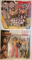 Front view of WrestleMania AJ Styles vs Shinsuke Nakamura 2-pack in original packaging showing two action figures and collectible details.