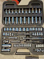 Mastercraft socket set in black plastic carrying case showing organized sockets, ratchets, extensions, and handle