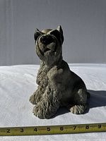 Side view of seated Schnauzer piggy bank showing detailed fur texture and face, with measuring tape indicating approximately 5 inches tall.