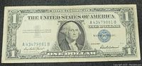 Front side of the 1957 $1 Silver Certificate note showing George Washington portrait, serial numbers, and signatures.