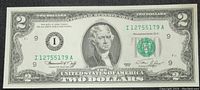 Front side of the 1976 $2 bill showing Thomas Jefferson with green Treasury seal and serial numbers.