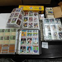 Overview of two binders of sports cards, loose card stacks, 1990 Score box, and military cards box