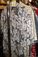 Front view of blue and white floral print Hawaiian shirt, showing button-up short sleeve style