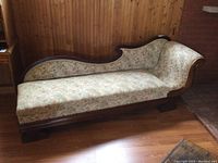 Front view showing full length, frame and upholstery pattern