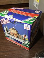 Original Zellers box for 7-piece ceramic lighted Christmas village set with price tag