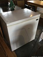 White Kenmore chest freezer angled view showing size and condition