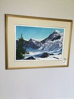 Framed oil painting hung on wall showing full artwork and frame.