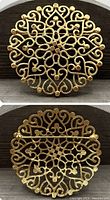 Front and back view of the large gold tone round brooch featuring a detailed swirl pattern and the pin closure on the reverse side with the Trifari crown mark.