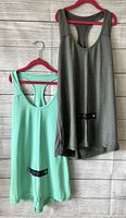 Front view of two Xersion tank tops on hangers, one sparkling mint green and one grey, showing size small and new condition with tags.