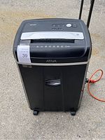 Front view of Ativa paper shredder 20CA0220 with control panel and paper slot visible.