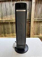 Front view of the Lasko ceramic element tower space heater showing its full height and base.