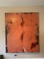 Front view of large abstract painting by Andrea Bolley, orange textured canvas with brown and white accents in thin frame