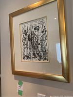 Frontal view of framed black and white lithograph print by Marc Chagall titled 'Les musiciens vagabonds' hanging on wall