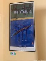 Full view of the framed print depicting an abstract rowing scene with vibrant color blocks and oarsmen on water.