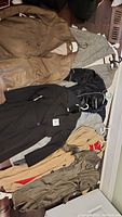 Overview photo of all six jackets including leather, wool, satin and trench style.
