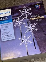 Photo of the Philips 4 lawn stakes Christmas snowflake LED lights box showing branding and product type.