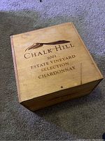 Top view of the closed wooden Chalk Hill wine box with 2001 Estate Vineyard Selection Chardonnay engraving on lid.